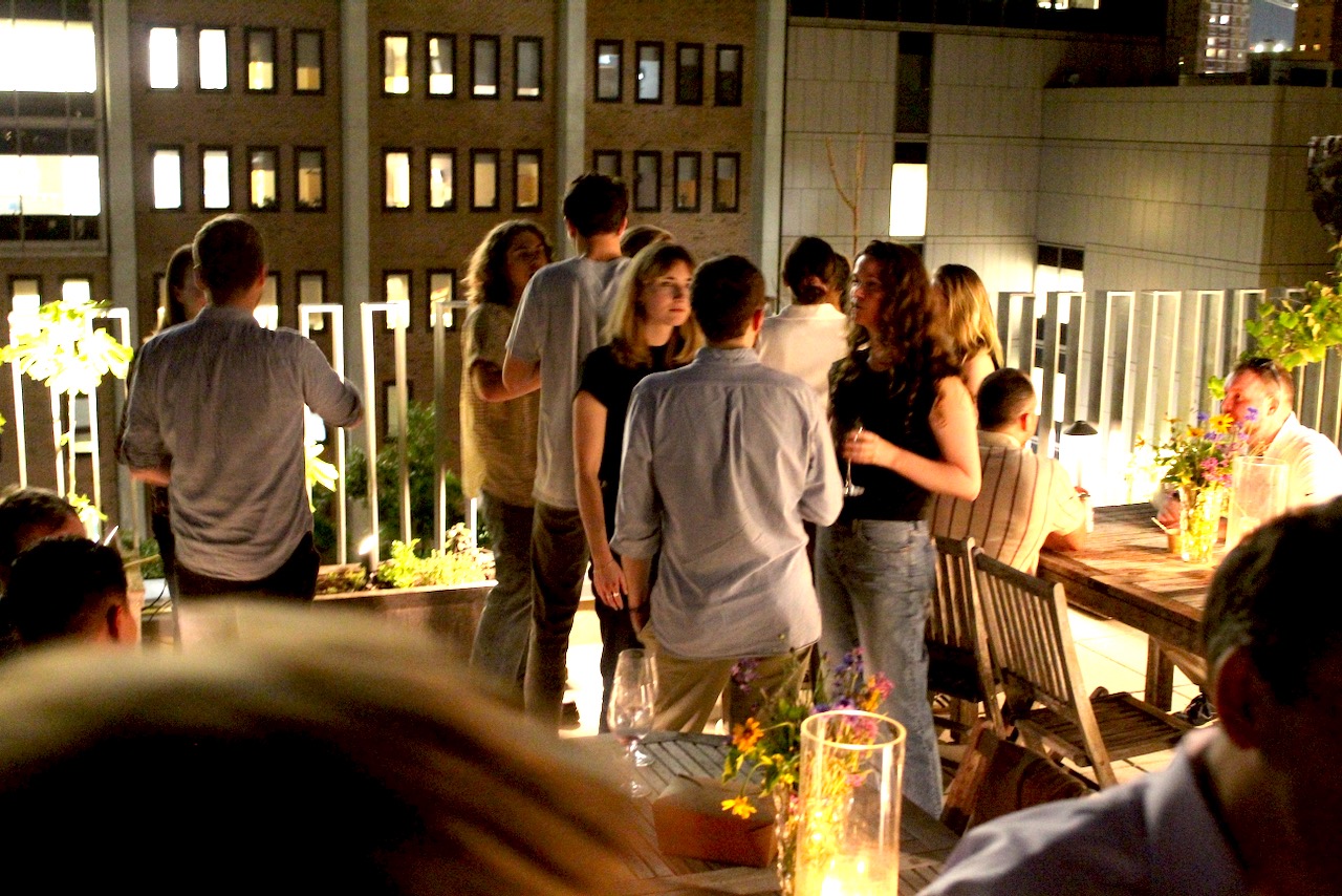 Guests gathering on the rooftop at Betty